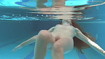 Irina Russaka strips naked in the swimming pool Konulu Porno